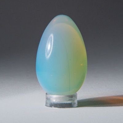 Top quality, polished creamy opalite crystal egg from Pakistan, this opalite yoni egg is an ideal gift. Opalite stones bring distinctive physical properties and stunning colours, as this material is created from opalizing glass. Additionally, it carries a subtle yet dynamic spiritual energy to help users through life's different stages. Stock photo is shown. A similar size, weight, and quality specimen will be sent. | Astro Gallery of Gems Genuine Polished Small Opalite Crystal Egg blue/Yellow 1 Opalite Crystal, Crystal Egg, Physical Properties, Spiritual Energy, Egg Shape, Spirituality Energy, Branding Inspiration, Decorative Objects, Blue Yellow