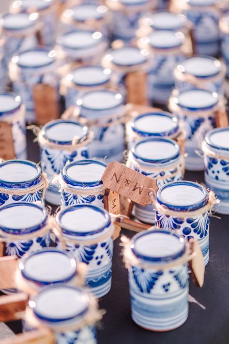 Blue and white talavera shot glasses pictured with the bride and groom's initials tagged. Wedding Favors For Guests Mexican, Mexico Wedding Party Favors, Wedding Favors Mexican, Blue And White Talavera Wedding, Blue Talavera Wedding, Mexican Wedding Party Favors, Colombian Wedding Ideas, Mexico Wedding Favors, Talavera Wedding Decor