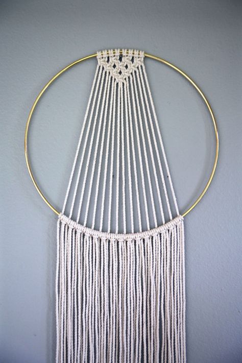 Dreamy handmade macrame wall hanging, made from 3mm natural white cotton rope and a 10 brass ring. Features a sleek modern design and long fringe. Measures approx. 55 total length. Would make a lovely gift! This item is MADE TO ORDER! Please allow 3-5 business days for production. ✦ 6 Ring Version ✦ www.etsy.com/listing/263389468 ✦ 14 Ring Version ✦ www.etsy.com/listing/453038026 ✦ Shop Brass Ring Wall Hangings ✦ www.etsy.com/shop/BermudaDream?section_id=... Small Macrame Dream Catcher Diy, Geometric Macrame Tutorial, Simple Macrame Dream Catcher, Macrame Metal Hoop Ideas, Gold Ring Macrame Wall Hanging, Atrapasueños Diy, Macrame Dream Catcher, Free Macrame Patterns, Dekor Diy