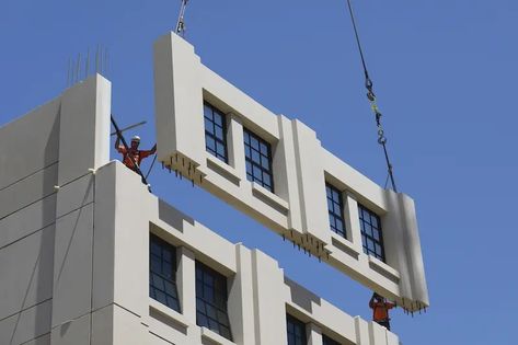 An exterior wall panel, manufactured by Clark Pacific, is positioned into place. Image: Clark Pacific Exterior Wall Panels, Robie House, Modular Housing, Seattle Hotels, Facade Panel, Build Your House, Construction Waste, Modular Building, Amazing Buildings