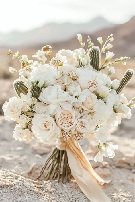 Bridal Bouquets with Gold and Cactus Accents ​A desert glam bouquet featuring blush tones, gilded elements, and succulent accents makes a stunning statement on your big day. Desert Bridal Bouquet, Glam Bouquet, Unusual Wedding Bouquets, Succulent Wedding Bouquet, Desert Glam, Southwest Chic, Succulent Bouquet Wedding, Reception Entrance, Desert Chic