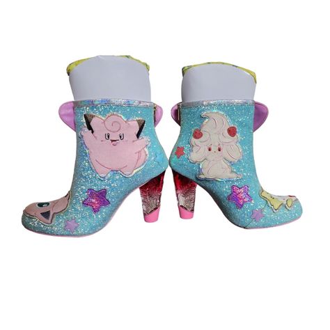 Irregular Choice Pokmon Twinkle Toes Togepi And Jigglypuff Heeled Boots Feature Glittering Pale Blue Material, Togepi, Alcremie, Jigglypuff, And Clefairy Appliques, Multicolored Star Appliques, And A Large Rainbow-Colored Faux Fur Star With A Holographic Image. A Zipper Down The Back Of Each Boot Assists With Slipping Into These Charming Boots, While The Pink-Ombre Heels Polish The Look Of These Alluring Shoes! Product Highlights Polyurethane Faux Leather Uppers, Synthetic Soles Cushioned Insole Pink Kawaii Heels For Party, Pokémon Star, Irregular Choice Shoes, Gothic Shoes, Star W, Twinkle Toes, Irregular Choice, Pink Ombre, Pale Blue