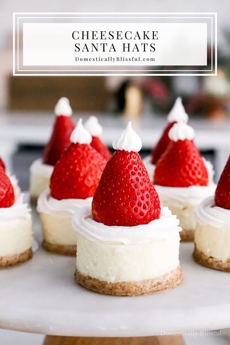 Cheesecake Santa Hats - Domestically Blissful Santa Cheesecake Hats, Xmas Cheesecake Recipes, Santa Hat Cheesecake Bites, Cheesecake Christmas Holiday Desserts, Christmas Desserts To Sell, Santa Hat Dessert, Christmas Dessers, Cheesecake Santa Hats, Christmas Mini Cheesecakes