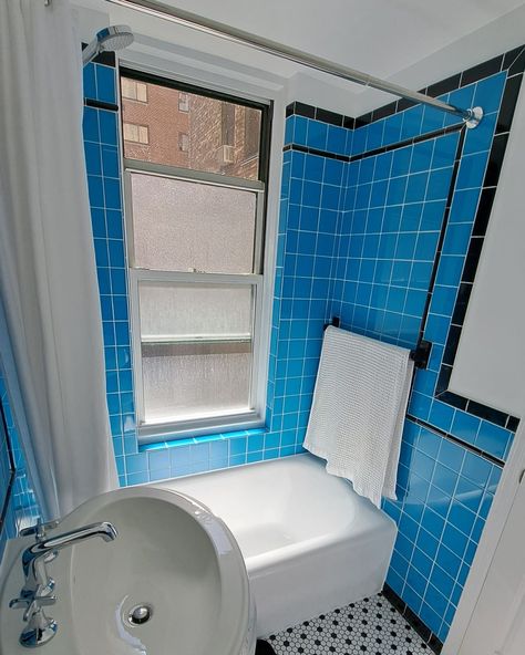 The standout feature in the “after” is the vintage-inspired tile. The floor tile is from The Home Depot, and the black and blue wall tiles are from Daltile. Credit: <a href="https://www.instagram.com/cleanqueer/">Dale Aucoin</a> Bathroom 90s, Vintage Blue Tile Bathroom, Blue Wall Tiles, Vintage Blue Bathroom, Dark Blue Tile, Best Indoor Trees, Black And White Floor, Blue Tile Wall, Kitchen Bohemian