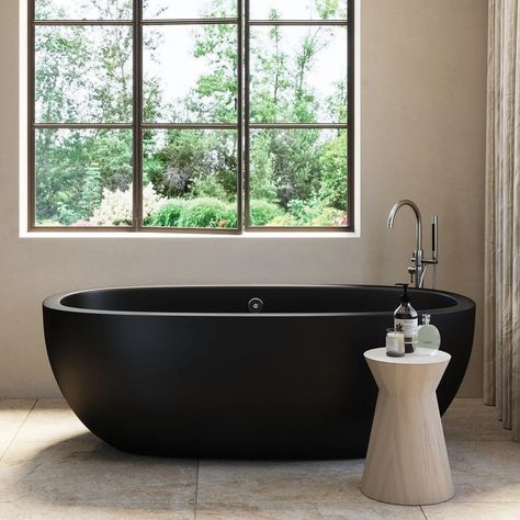 8 Best Bathtubs To Buy For Your Bathroom | The Family Handyman Cement Bathtub, Concrete Bathtub, Black Bathtub, Deep Tub, Best Bathtubs, Black Bath, Soaker Tub, Concrete Stone, Contemporary Crafts