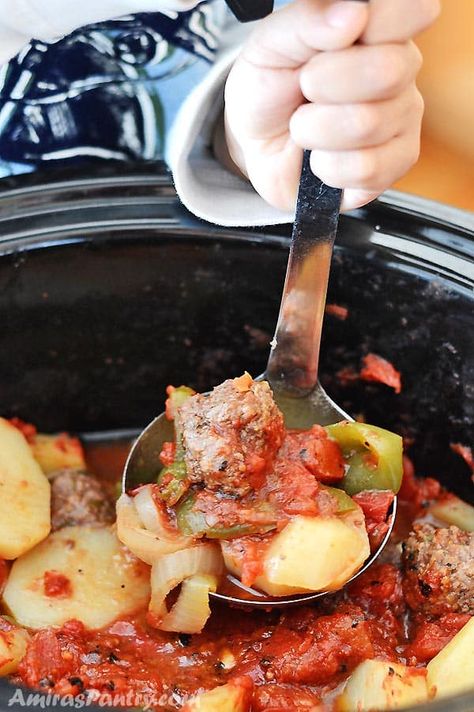 A child's hand holding a ladle and scooping some saucy meatballs from the slow cooker. Syrian Food Recipes, Syrian Dishes, Syrian Cuisine, Saucy Meatballs, Syrian Recipes, Arabic Dishes, Crockpot Meatballs, Meatball Recipes Crockpot, Unique Dishes