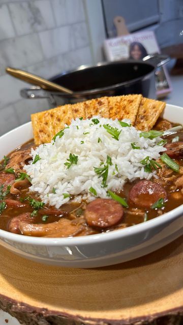 Kardea Brown on Instagram: "This is a “we got food in the house” meal 😂😂😂 Roasted chicken and sausage gumbo served seasoned crackers and rice! I spatchcocked and baked the chicken with a little herbs and spices then I hand shredded the meat. In a stock pot I cooked some andouille sausage then made my chocolate roux. That’s the trick to making an authentic gumbo…..got have that dark roux (it takes some time but it’s a must). I added my trinity (diced bell pepper, onions and celery)….I added some better than bullion roasted chicken, I put the cooked meats back in the pot. I seasoned with some creole seasoning, bay leaves and gumbo file. Add some water and let it simmer covered for 45 mins. I cooked some rice and made seasoned saltine crackers (made with melted unsalted butter and my house Seasoned Saltine Crackers, Authentic Gumbo, Kardea Brown, Chicken And Sausage Gumbo, Dark Roux, Gumbo File, Seasoned Crackers, Chicken And Sausage, Sausage Gumbo