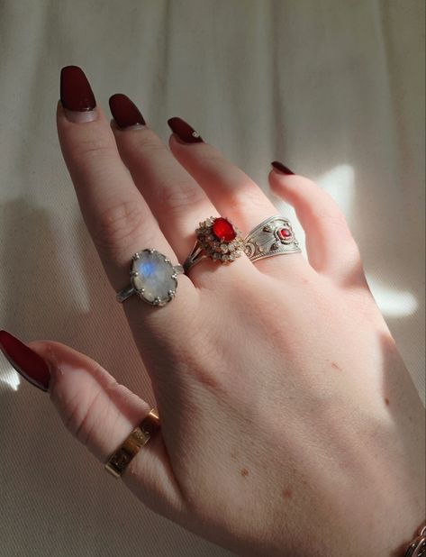 dark aesthetic vampire core. Dark red nails and red gemstone rings Vampire Rings Aesthetic, Dating A Vampire Aesthetic, Vampire Accessories Aesthetic, Vampire Fairy Aesthetic, Rich Vampire Aesthetic, Vampire Modern Aesthetic, 70s Vampire Aesthetic, Vampire Vibes Aesthetic, Vamp Birthday