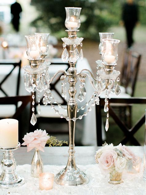 It’s time to take your wedding centerpieces up a notch with decadent sparkles, beaded embellishments and towering vases. Take a look at these 13 glamorous centerpieces with serious bling. Bling Wedding Theme, Bling Centerpiece, Silver Candelabra, Candelabra Centerpiece, Wedding Motifs, Decoration Evenementielle, Crystal Centerpieces, Unique Wedding Flowers, Bling Wedding