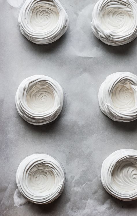 Homemade meringue cups are filled with vanilla bean whipped cream and roasted rhubarb. The perfect spring dessert! Meringue Photography, Meringue Cups, Homemade Meringue, Vanilla Bean Whipped Cream, Rhubarb Meringue, Berry Pavlova, Lemon Whipped Cream, Roasted Rhubarb, Spring Time Desserts