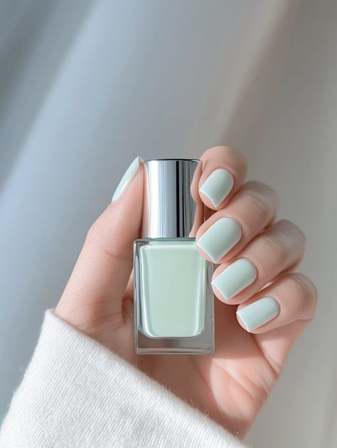 Soft mint green nails and polish gleam in natural light, showcasing a fresh, calming vibe perfect for springtime elegance. ✨💅 #N Lite Green Nails, Light Mint Nails, Mint Colored Nails, Green Manicure, Beauty Ecommerce, Mint Green Nails, Mint Nails, Soft Mint Green, Soft Mint