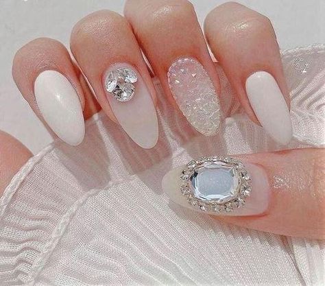 Gorgeous Milky White Almond Nails with Gems Nail Milky White, Almond Nails With Gems, Milky White Almond Nails, White Diamond Nails, White Nails With Rhinestones, Nails With Gems, Diy Rhinestone Nails, White Almond Nails, White Nails With Gold