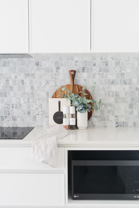 As a special mother-in-law gift, Gina from Style Curator took our latest kitchen renovation project. This white kitchen with gorgeous slim shaker cabinets and grey marble mosaic splashback creates a real sense of light, especially with the white joinery and white cabinetry. For the full kitchen makeover with details, check out our blog post by clicking the pin or go to StyleCurator.com.au. Modern Kitchen Splashbacks, Slim Shaker Cabinet, Shaker Cabinets Kitchen, Slim Shaker, White Kitchen Splashback, Kitchen Splash Back, Kitchen Splashback Tiles, Farmhouse Outdoor, Kitchen Backsplash Designs