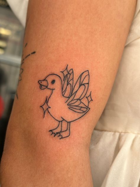 Duck tattoo, fine lines, fairy wings Dainty Duck Tattoo, Duck Tattoos Small Funny, Pretty Duck Tattoo, Simple Duck Tattoo Cute, Tattoo Ideas Duck, Funny Duck Tattoo, Cute Duck Tattoo, Duck Tattoos, Simple Tattoos