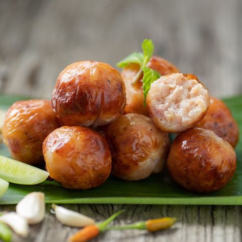 Amazing Thailand on Instagram: “An Isan native snack to blow your tastebuds! This is Sai Krok Isan or fermented pork sausage. Made from minced pork, garlic, and steamed…” Authentic Thai Food, Thai Foods, Minced Pork, Cabbages, Steamed Rice, Pork Sausage, Sausages, Thai Recipes, Local Food