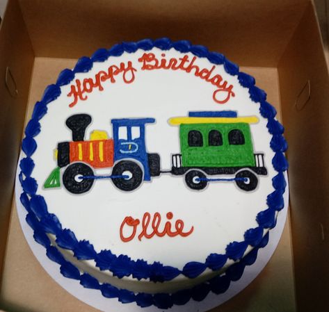 Colorful train engine and caboose drawn on a birthday cake for a little one Train Buttercream Cake, Buttercream Train Cake, Train Party Cake, Train Cake Ideas, Train Theme Cake, Dinosaur Train Cakes, Tractor Birthday Cakes, Train Birthday Cake, Baby Boy Birthday Cake