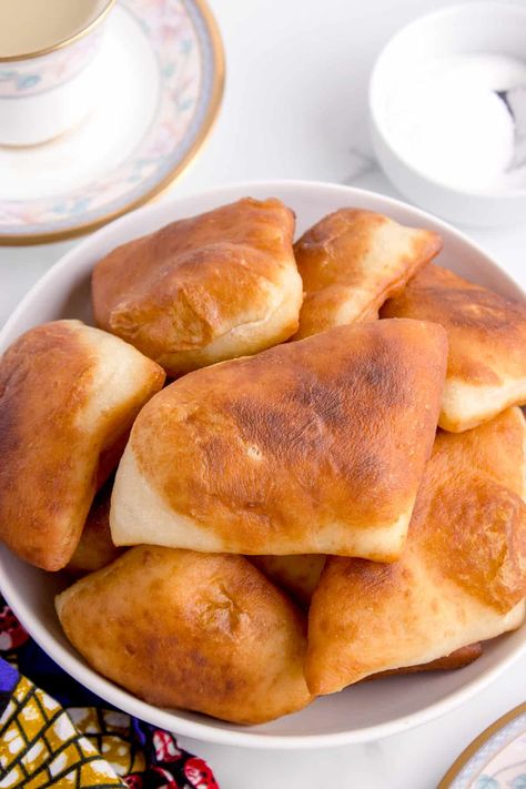 Mandazi in a bowl Magwinya Recipe, Kenyan Mandazi Recipe, Mandazi Recipe Kenya No Yeast, Jordanian Mansaf, Mandazi Recipe, Kenyan Tea, Pizza Wheel, Babka Recipe, Dough Balls