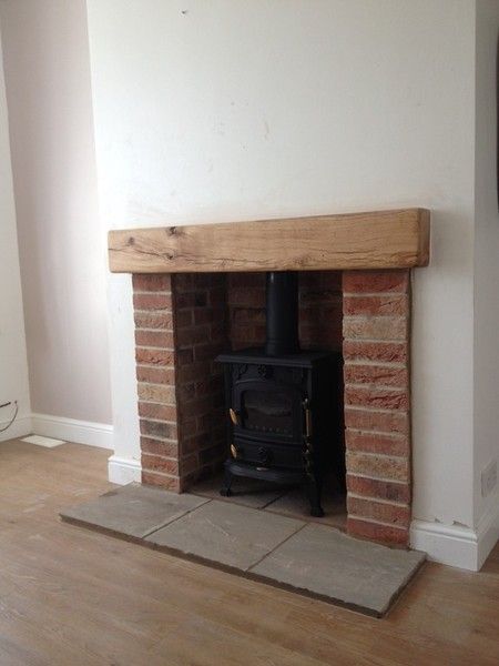 Brick, tile and oak fireplace Oak Beam Fireplace, Exposed Brick Fireplaces, Wood Burner Fireplace, Wood Burning Stoves Living Room, Log Burner Fireplace, Log Burner Living Room, Brick Slips, Oak Fireplace, Wood Stove Fireplace