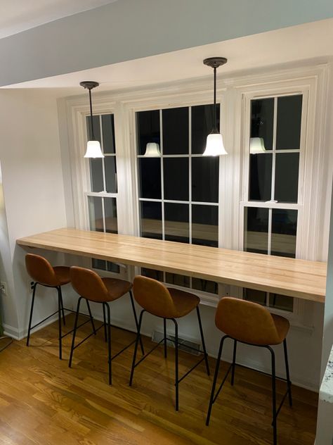 Breakfast Bar Against Window, Window Bar Seating Kitchen, Kitchen Bar Counter Wall Ideas, Bar Stools With Butcher Block Island, Bar Table In Front Of Window, Bar Counter Apartment, Bar Seating In Kitchen American, Floating Countertop In Front Of Window, Kitchen Window Bar Counter Indoor