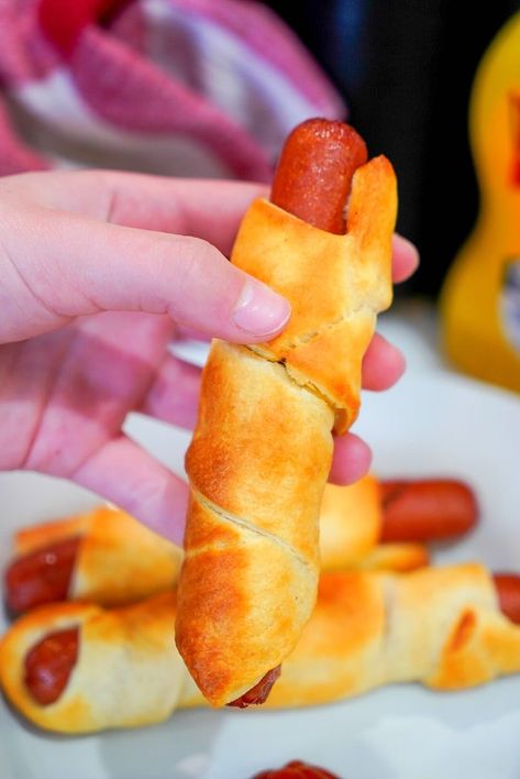 Best air fryer pigs in a blanket are my kids favorite snacks! Easy recipe to make with crescent rolls and hot dogs that turns out crunchy to perfection every time. Hot Dogs In A Blanket, Dogs In A Blanket, Make With Crescent Rolls, Quick Cinnamon Rolls, Air Fryer Fish, Air Fryer Cooking Times, Frozen French Fries, Snacks Easy, Air Fryer Oven Recipes