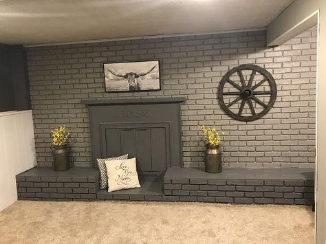 Gray Brick Accent Wall, Basement Brick Wall Ideas Paint Colors, Grey Brick Accent Wall, White Brick Basement Walls, Painted Cement Block Walls Basement, Painted Brick Wall Interior, Briks Painting Wall, Living Room With Brick Wall, Painting Basement Walls