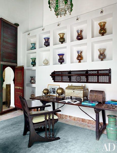 An Artemide lamp tops one of the Syrian side tables in Bravo’s former bedroom; the headboard is draped with a wool blanket, the coverlet is a Berber wedding blanket, the chest is antique Moroccan, and the Tuareg carpet is made of woven leather and palm fronds. Morocco Interior Design, Artemide Lamp, Berber Wedding, Exotic Bedrooms, Morocco Interior, Moroccan Houses, Claudio Bravo, Moroccan Interior Design, Moroccan Style Interior