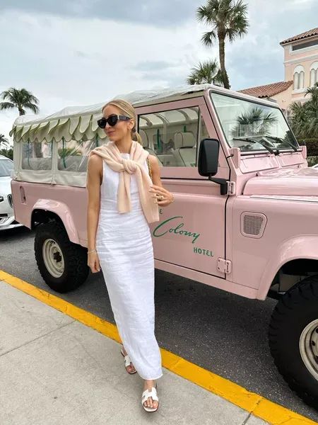 My outfit for a day in Palm Beach! I wore a white linen dress and tied a pink cashmere sweater around the neck (which I packed to wear with jeans too). Tap to shop and bring this fashion inspo to life! White Summer Dress Outfit, White Dress Outfit Summer, Palm Beach Fashion, Beach Style Outfit, Pink Cashmere Sweater, Midi Dress Outfit, White Linen Dress, Palm Beach Style, Resort Outfit