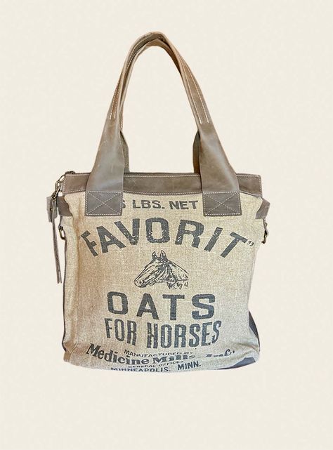 "Favorit Oats Convertible American Glory are meticulously handcrafted Handbags & Accessories, inspired by history vintage burlap sack designs are nostalgic and gives a connection to America's past. Burlap grain sack of Oats For Horses made in Minneapolis, MINN, image is a replication of burlap sack printed on upholstery grade linen for heavy duty strength and supple distressed leather trims, you will love the look and feel of this handbag. Convertible is a great carry all bag (baby bag, computer Teachers Bag, Stuff Bag, Handcrafted Handbags, Vintage Burlap, Burlap Canvas, Burlap Sacks, Teacher Bags, Fabric Handbags, Sack Bag