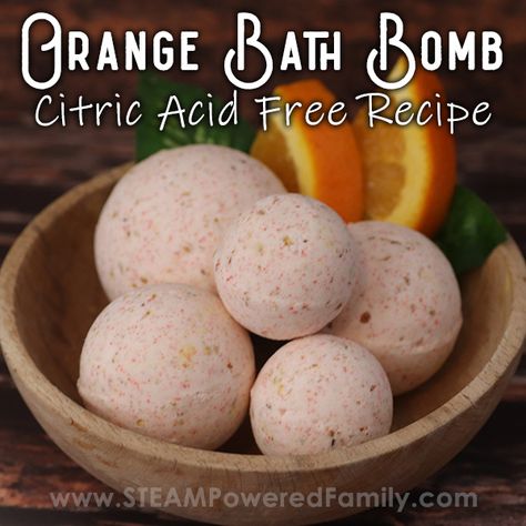 A sweet orange bath bomb project as we continue to explore the science of bath bombs. This is a bath bomb recipe without citric acid, instead using dried buttermilk. Kids will love making this recipe and exploring how changing out the acid in our bath bomb acid-base reaction, alters the bath bomb fizzing and erupting. We also used natural colourants this time. The best part is the smell, so much orange, relaxing goodness! Try this bath bomb project yourself. #BathBombs #CitricAcid Learning Chemistry, Bath Therapy, Diy Cleanse, Dry Buttermilk, Bath Bomb Recipe, Lily Photography, Orange Bath, Homemade Spa, Dried Orange Peel