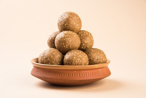 Photo pile of handmade tilgul laddu or t... | Premium Photo #Freepik #photo #sesame #sesame-seeds #laddu #jaggery Seeds Laddu, Til Laddu, Makar Sankranti Festival, Makar Sankranti, Collage Wall, Art Collage Wall, Sesame Seeds, Art Collage, A Bowl