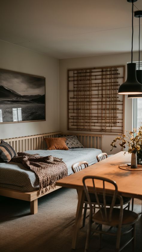 Discover the perfect blend of dining and relaxation in this beautifully styled Zen-inspired space! Featuring an IKEA-style bed along the wall opposite a chic dining table, this setup offers a cozy lounge area for unwinding after meals. The woven throw and decorative cushions add warmth, while a stunning landscape print brings personality to the room. Pendant lights above the dining table create a welcoming glow, making it ideal for gatherings or quiet evenings. Ready to elevate your home decor? Click to explore more ideas! #ZenHome #IKEAStyle #DiningRoomInspo #CozySpaces #HomeDecorIdeas Lounge Vibes, Chic Dining Table, Ikea Style, Style Bed, Cozy Lounge, Style Lounge, Lounge Area, Woven Throw, Maximize Space