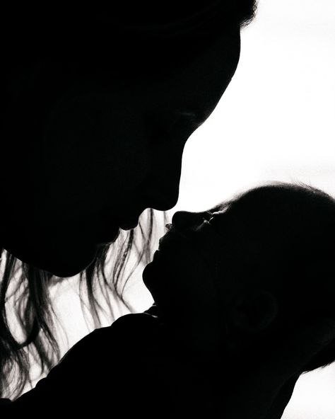 Newborn session but make it B&W! 🖤🤍 ID: The silhouettes of a mother holding her newborn baby to her face. Their noses almost touch. #KatieNelsonPhotography #Newborn #StMarysOntario #StMarysOntarioPhotographer #StratfordOntarioPhotographer #OntarioNewbornPhotographer #StratfordOntarioFamilyPhotographer Dark Newborn Photography, Newborn Poses At Home, Black And White Newborn Photography, Moody Newborn Photography, Easy Newborn Photography, Easy Newborn Poses At Home, Easy Newborn Poses, Poses At Home, Stratford Ontario