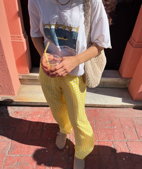 Gingham trousers and a graphic tee—simple and stylish. 💛 Stay comfortable and cool with this easy combo. #gingham #graphictee #Móide #ginghamtrousers #summeroutfits Gingham Trousers, Gingham, Graphic Tee, Summer Outfits, Graphic Tees, Trousers, Quick Saves, Clothes