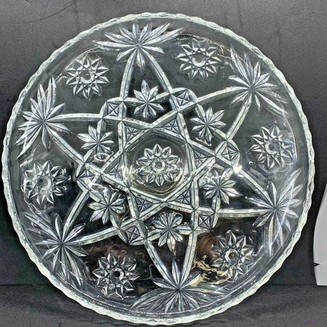 "Anchor Hocking has always created wonderful, practical serveware that has helped millions of households over the years. This vintage Star of David serving platter, is no different! Sawtooth rim, fine cut glass, and one of the most popular designs made by AH! This platter has seen some use; as you will see in the photos-- just a couple spots over the years. It is a beautiful piece, with just a couple of surface scratches, but no chips, breaks, cracks or crazing in the crystal. Please see the photos for more details. The platter measures 13.5\" inches in diameter" Crystal Glassware Antiques, Vintage Pyrex Patterns, Vintage Dishes Antiques, Vintage Kitchen Accessories, Pyrex Patterns, Vintage Glassware Antiques, Vintage Jewelry Antique, Vintage Dishware, Vintage Kitchen Utensils