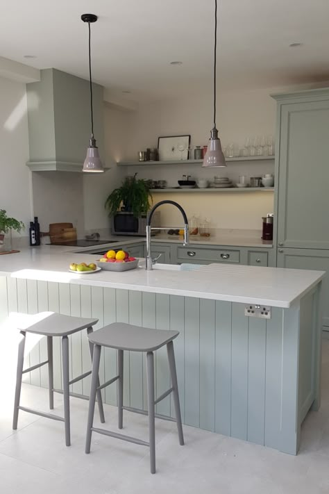 This stunning, pale green hand painted kitchen has a large breakfast bar with built-in sink and lovely open plan shelving creating a country feel. The beaded cabinets are complemented with white quartz worktops and chrome fixings #lightgreenkitchen #traditionalkitchen Small Open Plan Kitchens, Open Plan Kitchen Dining Living, Desain Pantry, Kabinet Dapur, Open Plan Kitchen Dining, Open Plan Kitchen Living Room, Breakfast Bar Kitchen, Kitchen Dining Living, Kitchen Room Design