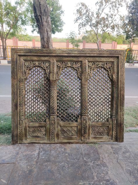 Carved wooden triple wall panel/wall decor panel/Indian carved wall panel/jali carved wall panel/intricately carved wood panel/wall Hanging panel. Distressed  finished triple  jali carved wall panel is a perfect indian vintage decor for your home.  This beautiful intricately carved wooden art panel has intrinsic designs carved into it by our skilled workers. The panel has been made of mango wood and has clips behind to hang it on the wall. Size :-  180x150 cm Weight :- Kg Region of Origin: India Primary Material: Wood Any import duty or taxes in your country. Jali Wall, Wood Carved Headboard, Carved Wall Panel, Carved Wood Panel, Carved Wood Wall Decor, Panel Wall Decor, Wood Panel Wall, Carved Wooden Panels, Artistic Room