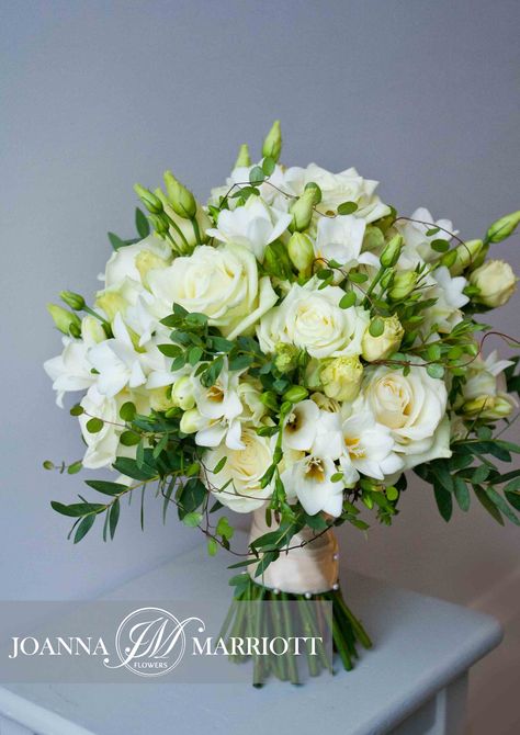 White bridal bouquet composed of white roses, white freesia and cream lisianthus. Nature inspired bouquet, white wedding, English wedding. Rose And Freesia Wedding Bouquet, Roses And Freesia Bouquet, White Freesia Bouquet, Fresia Bouquet Wedding, Wedding Hand Bouquet Brides, Cream Lisianthus, Freesia Wedding Bouquet, Lisianthus Wedding, Freesia Wedding