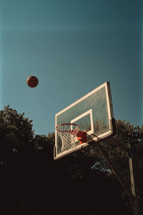 Vave BG - A basketball flies towards the hoop, 35mm lens, a real photograph with a cinematic feel, basketball backboard and net, bright colors, cinematic lighting, daylight, depth of field Basketball Vibes, Basketball Aesthetic, Photography Composition, Basketball Backboard, Cinematic Lighting, Basketball Photography, Composition Photography, A Basketball, Depth Of Field