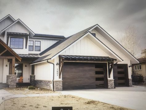 Shed roof over garage & 2nd story. Garage doors Roof Above Garage Doors, Shed Roof Over Garage Doors, Brown Garage Door, Pole Barn Ideas, Black Metal Roof, Lean To Roof, Cabin Farmhouse, Bedroom Patio, Modern Farmhouse Living Room Decor