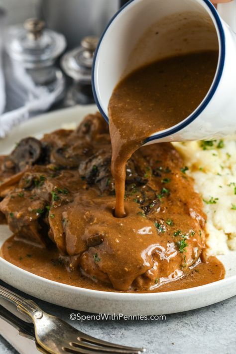 Use boneless or bone-in chops for this simple Crockpot Pork Chops recipe. Smothered in a rich gravy made with two kinds of easy canned soup and mushrooms, this recipe is failproof and delish. This is one of the best slow cooker recipes for when comfort food is on the menu! Enjoy with potatoes for a satisfying dinner. #crockpotporkchops #easyrecipe #creamofmushroom #spendwithpennies Mushroom Onion Gravy, Pork Chops Smothered, Crock Pot Pork Chops, Simple Crockpot, Crock Pot Pork, Pork Crockpot Recipes, Pork Chop Recipes Crockpot, Tender Pork Chops, Canned Soup