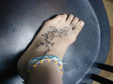 Others opt to get flowers, such as the cherry blossom foot tattoo design, that run diagonally across the foot. Description from pinterest.com. I searched for this on bing.com/images Vine Foot Tattoos, Foot Tattoo Designs, Places For Tattoos, Foot Tattoos For Women, Tattoos For Women Flowers, Foot Tattoo, Viking Tattoos, Elegant Tattoos, Henna Tattoo Designs