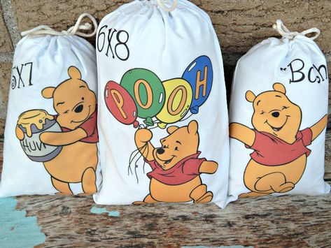 "6 favor bags Winnie-The-Pooh Favor bags birthday celebration bags 6 bags per order  FREE PERSONALIZING AND FREE SHIPPING ON EVERY ORDER -------ORDERING INFORMATION AND FAQ'S ------- ---MADE OF AND SIZE'S--- My bags are a High quality white Cotton reusable drawstring bag made in the USA Size- Large 6\" X 8\". perfect size for candy small gifts or little prizes goodie bags ---PERSONALIZING--- FREE personalizing with any celebrate or if you like a different name on each bag that is also popular In Pooh Bebe, Winnie The Pooh Birthday Party, Pooh Birthday Party, Birthday Party Bags, Favor Bags Birthday, Winnie The Pooh Themes, Pooh Birthday, Movie Cartoon, Winnie The Pooh Birthday