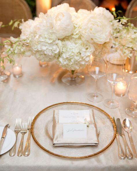 Full, white peonies, roses, and hydrangeas sit alongside ivory-and-gold table settings. Peonies Wedding Centerpieces, Gold Wedding Centerpieces, Hydrangea Bouquet Wedding, Summer Wedding Reception, Boda Mexicana, Peony Wedding, Santa Barbara Wedding, Martha Stewart Weddings, Wedding Flower Arrangements