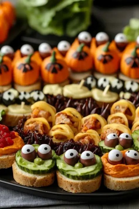 Get ready for Halloween with these creepy yet tasty finger foods that will wow your guests! This collection features easy recipes for spooky appetizers that look great on any party table. From spooky eyeball meatballs to monster-themed veggies, these delicious treats will delight children and adults alike. Perfect for Halloween gatherings or a fun family night! Impress your friends with themed snacks that are fun to make and even more fun to eat. Step up your Halloween party game with these fun bites! Animal Appetizers, Eyeball Meatballs, Spooky Appetizers, Woodland Party Food, Halloween Finger, Halloween Finger Foods, Themed Snacks, Party Bites, Finger Foods Easy