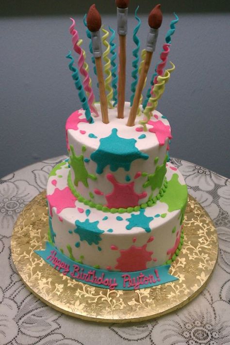 Paint Splatter Two Tiered Cake w/ Fondant Paint Brushes and Curlies from Something Special Bakery in Beaumont, TX Cake Pop Paint Pallet, Paint Splatter Birthday Cake, Slime Party Cake Ideas, Paint Party Cake Ideas, Splash Cake Ideas, Art Themed Birthday Cake, Paint Party Cake, Splash Cake, Paint Splatter Cake