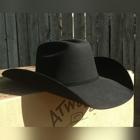 Shop barsevenssupply's closet or find the perfect look from millions of stylists. Fast shipping and buyer protection. Atwood Hat Co. 5X Black Fur Felt Cowboy Hat - 7 1/8 Hard to find and purchased direct from Atwood! Nice black 5X fur felt cowboy hat. Size 7 1/8. This hat is creased with Atwood's 4 3/4" low crown, and a 4" Hereford brim. Self band with silver buckle. Leather sweatband, and pretty purple satin lining. If you want a hat with Atwood's Low Crown crease, it has to be shaped at Black Leather Cowboy Hat, Types Of Cowboy Hats, Cowboy Hat Shapes, Black Felt Cowboy Hat, Best Cowboy Hats, Bling Horse Tack, Felt Cowboy Hat, Dodger Hats, Black Cowboy Hat