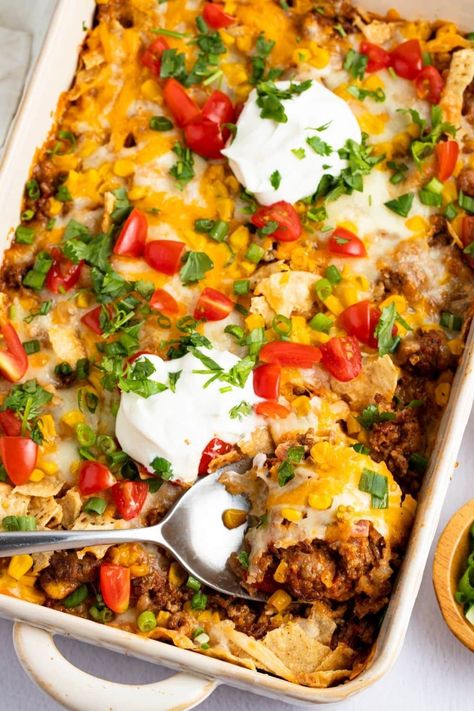 This easy taco casserole recipe gives you all the flavors you would want from a taco in one convenient dish. It's perfect for busy weeknights and much less work than a taco bar! Recipe With Corn, Easy Taco Casserole, Panini Recipes Chicken, Taco Bake, Taco Casserole, Easy Taco, Enchilada Casserole, Mexican Food Recipes Easy, Corn Chips