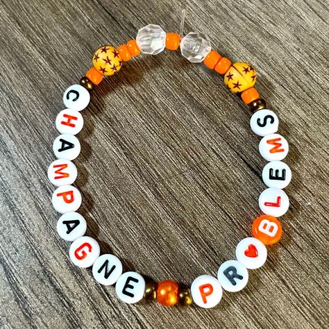 #Orange_Taylor_Swift_Bracelet #Orange_Taylor_Swift #Taylor_Swift_Bracelet #Taylor_Bracelet Fandom Bracelets, Tay Art, Taylor Swift Bracelets, Eras Bracelets, Swift Bracelet, Music Bracelet, Swift Bracelets, Pony Bead Projects, Kandi Inspo