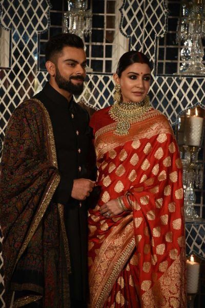 Anushka Sharma's Red Banarasi saree by Sabyasatchi | Banarasi.Net Virat Kohli Images, Cricket Virat Kohli, Virat Kohli And Anushka Sharma, Marriage Poses, Anushka Sharma And Virat, Draping Styles, Virat Kohli And Anushka, Virat And Anushka, Indian Groom Wear