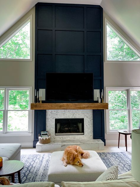 Black Trim Around Fireplace, Contrast Fireplace Wall, Fireplace Wall Dark Paint, Two Story Fireplace Wall With Windows, Trim Wall Fireplace, Board And Batten Two Story Fireplace, Fireplace Focal Wall Ideas, Modern Wall Paneling Fireplace, Tall Black Fireplace Wall High Ceilings